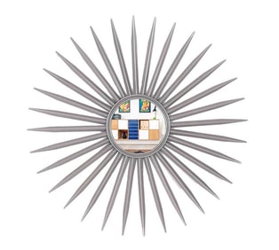AN IRON STARBURST FORM MIRROR.