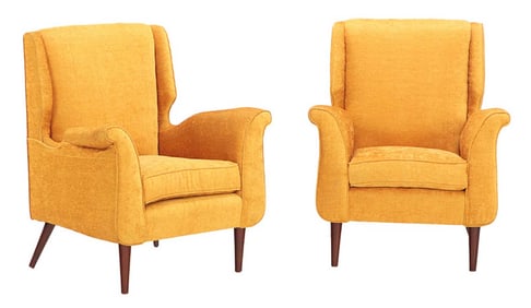 A PAIR OF UPHOLSTERED LOUNGE CHAIRS IN THE MANNER OF GIO PONTI.