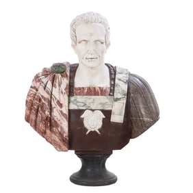 OVERSIZED CARVED MARBLE BUST OF A ROMAN EMPEROR CARVED FROM SEVERAL DIFFERENT STONES.