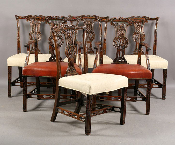 SET 6 CHIPPENDALE MAHOGANY DINING CHAIRS: Set of six Chippendale style carved mahogany dining chairs having shaped chair rails, pierced back splats and fretwork carved legs circa 1900. Consisting of two arms and four sides. Ht: 38" Width: 24"