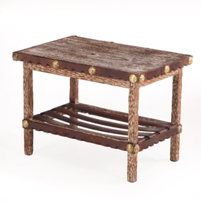 GOUGE CARVED CERUSED OAK OCCASIONAL TABLE TRIMMED IN LEATHER WITH BRASS BUTTONS C 1940.