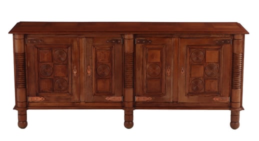 ONE OF TWO FRENCH OAK FOUR DOOR SIDEBOARDS IN THE MANNER OF CHARLES DUDOUYT C 1940. THE CASE HAVING