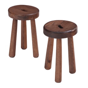 A PAIR OF WOODEN THREE LEG STOOLS IN THE MANNER OF OLAVI HANNINEN.