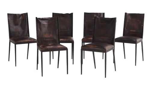 SIX IRON AND LEATHER DINING CHAIRS IN THE MANNER OF JEAN-MICHEL FRANK.