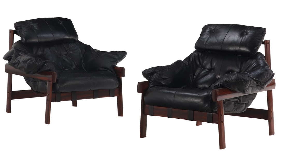 PAIR OF BRAZILIAN MAHOGANY AND LEATHER LOUNGE CHAIRS IN THE MANNER OF PERCIVAL LAFER.: Pair of Brazilian mahogany and leather lounge chairs in the manner of Percival Lafer. Ht: 33" Wd: 34" Dpth: 35" Seat: 16"