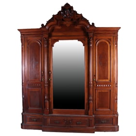 THREE DOOR AMERICAN VICTORIAN WALNUT ARMOIRE WITH WINGED FEMALE BUST C 1875. RECENTLY REMOVED FROM