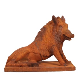 CAST IRON GARDEN SCULPTURE DEPICTING A BOAR IN REPOSE.