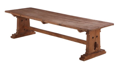 OVER SIZED FRENCH OAK FARM TABLE WITH TRESTLE BASE HAVING MORTIS AND TENON CONSTRUCTION.