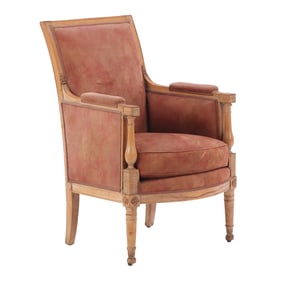 A NINETEENTH CENTURY FRENCH DIRECTOIRE BERGERE CHAIR UPHOLSTERED IN SUEDE.
