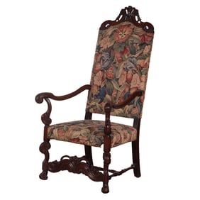 CARVED WALNUT NEEDLEPOINT  ARM CHAIR HAVING A TALL CRESTED BACK C 1920.