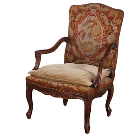 FRENCH LOUIS XV STYLE CARVED WALNUT NEEDLEPOINT OPEN ARM CHAIR C 1920.