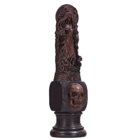MEMENTO MORI WOOD SCULPTURE DEPICTING A WOMAN WITH SKULLS