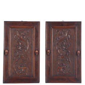 PAIR ANTIQUE CARVED WALNUT CABINET DOORS WITH CARVED SKULL PULLS, C 1800S