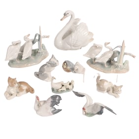 TEN LLADRO PORCELAIN ANIMAL FIGURINES INCLUDING GEESE, CATS, SWAN AND STORK C. 1990S