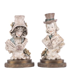 MATCHING PAINTED CERAMIC STATUES OF A WOMAN AND MAN RAISED ON STEPPED BRASS BASES.