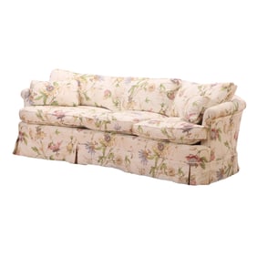 ONE OF TWO OVERSTUFFED SOFAS WITH FLORAL PRINT FABRIC,