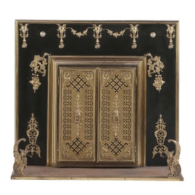 BRASS, BRONZE AND  IRON FIREPLACE SURROUND HAVING TWO DOORS WITH PIERCE WORK AND STANDING GRIFFINS C