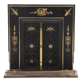 TWO PIECE FRENCH BRASS AND IRON FIREPLACE SURROUND HAVING TWO DOORS C 1950. INSERT CAN BE REMOVED.