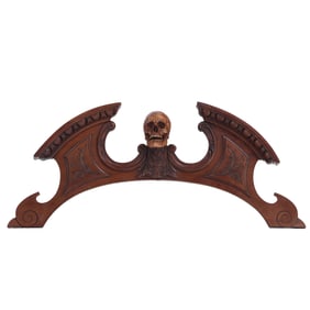 VICTORIAN ARCHED CREST WITH CARVED WOOD SKULL