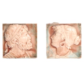 A PAIR OF GLAZED TILES FEATURING A MALE AND FEMALE BUST C 1890.