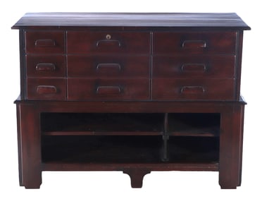 TWO PART COUNTER HAVING PANELED FRONT AND NINE DRAWERS ON THE REAR C 1920.