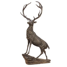 LARGE BRONZE GARDEN FIGURE OF A STAG STANDING ON A ROCK.