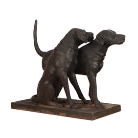 CAST IRON GARDEN STATUE DEPICTING TWO DOGS.