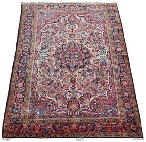 A SEMI-ANTIQUE PERSIAN LILLIHAN RUG 4'9" X 7'