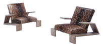 A PAIR OF CERUSED OAK AND DEER HIDE ARM CHAIRS IN THE MANNER OF JEAN-MICHEL FRANK.