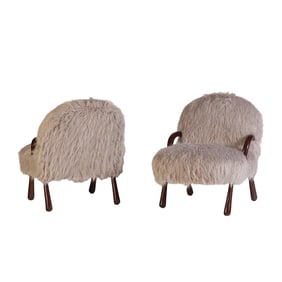 PAIR OF FAUX GOATSKIN UPHOLSTERED OPEN ARM CHAIRS WITH BAT FORM LEGS IN THE MANNER OF JEAN ROYERE.
