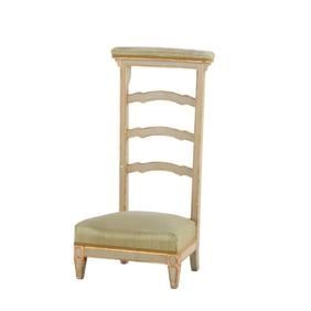 PAINTED AND GILTWOOD KNEELER IN THE MANNER OF JANSEN C 1910.