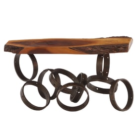 IRON RING FORM TABLE HAVING A FREE EDGE WOOD TOP.