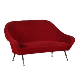 ITALIAN UPHOLSTERED SOFA C 1950 HAVING A CONTINUOUS BACK AND IRON LEGS.