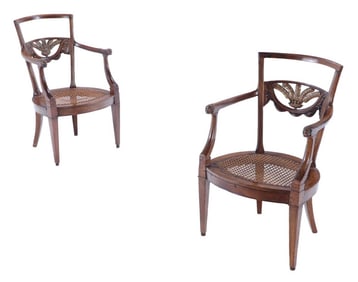 PAIR WALNUT DIRECTOIRE CARVED AND GILT OPEN ARM CHAIRS WITH PLUME CARVED BACK AND CANE SEATS
