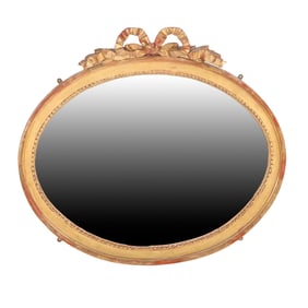 FRENCH CARVED AND GILTWOOD WALL MIRROR WITH RIBBON CARVED CREST C 1900.