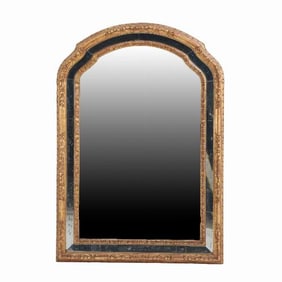 A French carved mahogany gilt mirror attributed to Jansen C 1945.