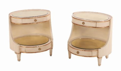 A pair of large Italian painted and giltwood oval nightstands C 1950.