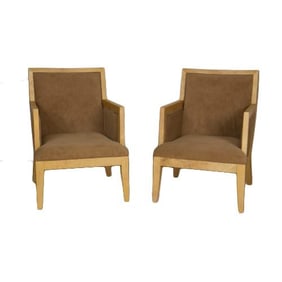 A pair of Jean-Michel Frank style parchment covered armchairs.