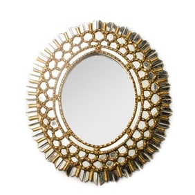 A French giltwood oval mirror in the manner of Line Vautrin C 1970 .