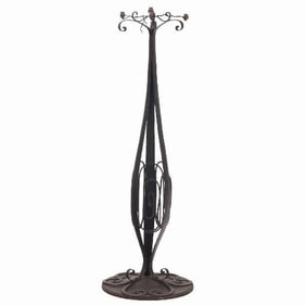 A French Art Deco hand hammered iron floor lamp C 1930.