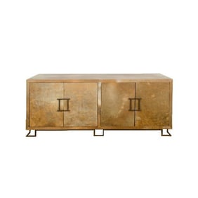 A parchment credenza in the manner of James Mont .