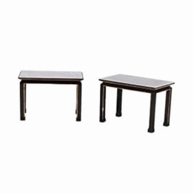 A pair of French ebonized and giltwood marble top end tables  in the manner of James Mont C 1950.