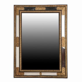 A rare large French ebonized wood and brass repousse mirror 19th C .