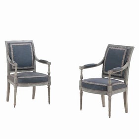A pair of French Directoire painted open armchairs C 1800.