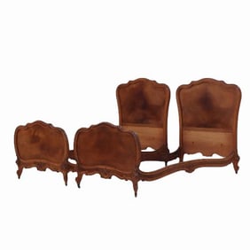 A pair of French Louis XV style walnut twin beds C 1900.