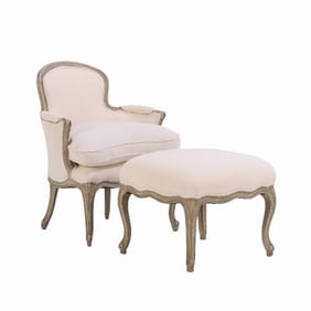 A French Louis XV style painted armchair and matching stool C 1910.