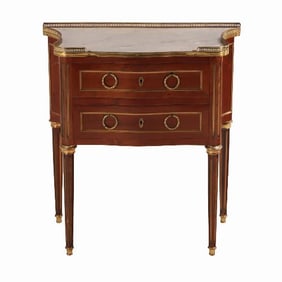 A quality French Louis XVI style mahogany bronze mounted petite marble top commode C 1910.