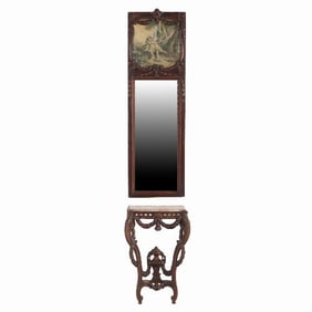 A 19th century French carved walnut console table with conforming trumeau mirror.
