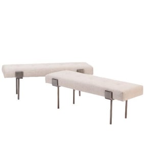 A pair of upholstered iron benches .