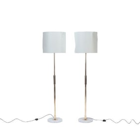 A pair of Italian MCM brass floor lamps circa 1950.